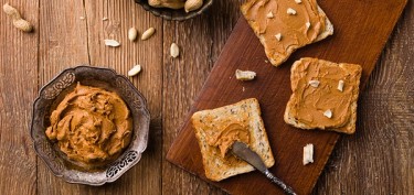peanut butter spread in thin slices of bread.