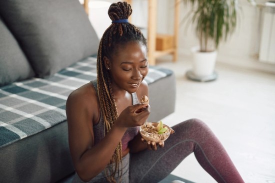 Woman enjoying peanut butter and apples