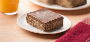 a square cereal bar topped with chocolate.