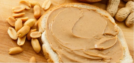 peanut butter spread on a piece of bread.