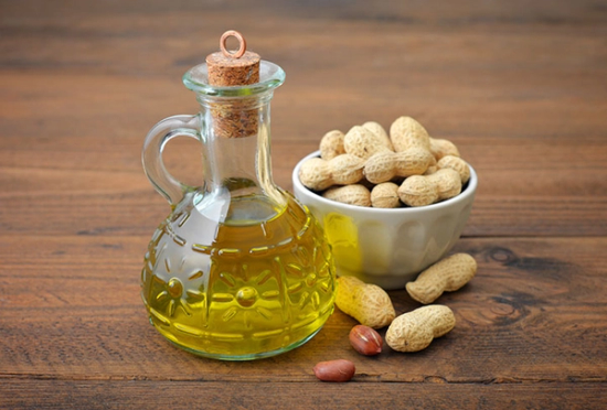 peanut oil in a glass holder