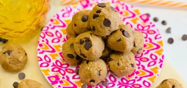 small balls of peanut butter cookies with chocolate chips.