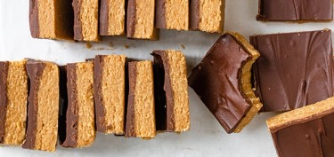 a dozen peanut bars topped with a generous chocolate layer.