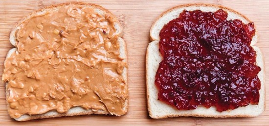 two pieces of bread with peanut butter and jelly on them.