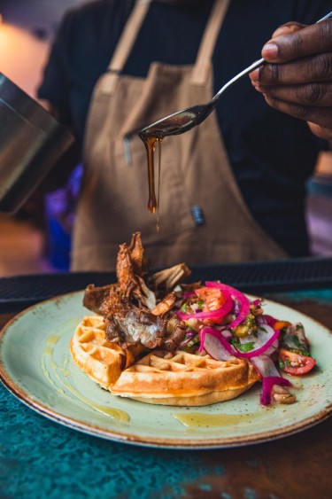mushrooms and waffles on a plate
