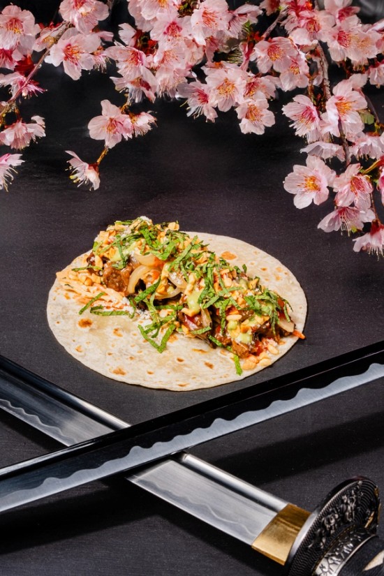 a plate surrounded by flowers and a ronin blade