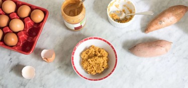 a bowl with a peanut butter and sweet potato mixture.