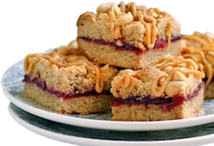 a plate with a stack of peanut butter and jelly bars.