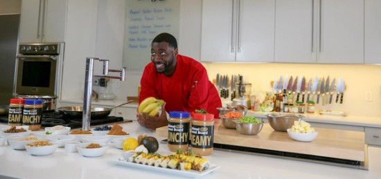 Chef Teren Green standing in a kitchen to prepe meals with peanut butter.