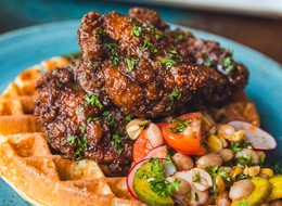 chickens and waffles on a plate