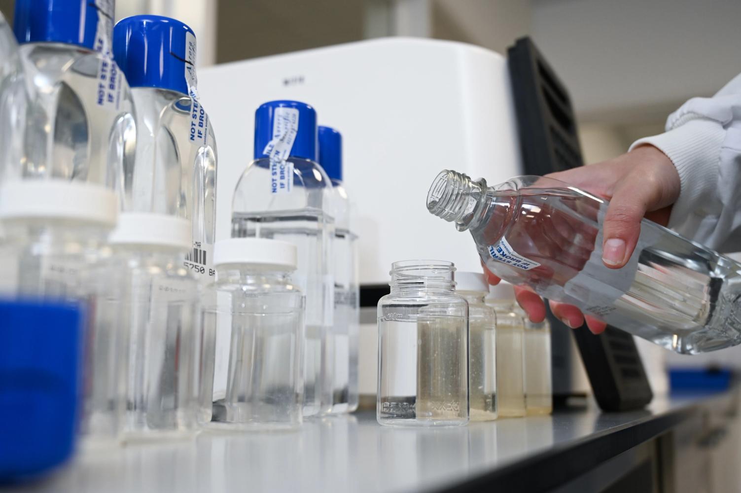 Photograph of chemical testing of water in sample bottles 