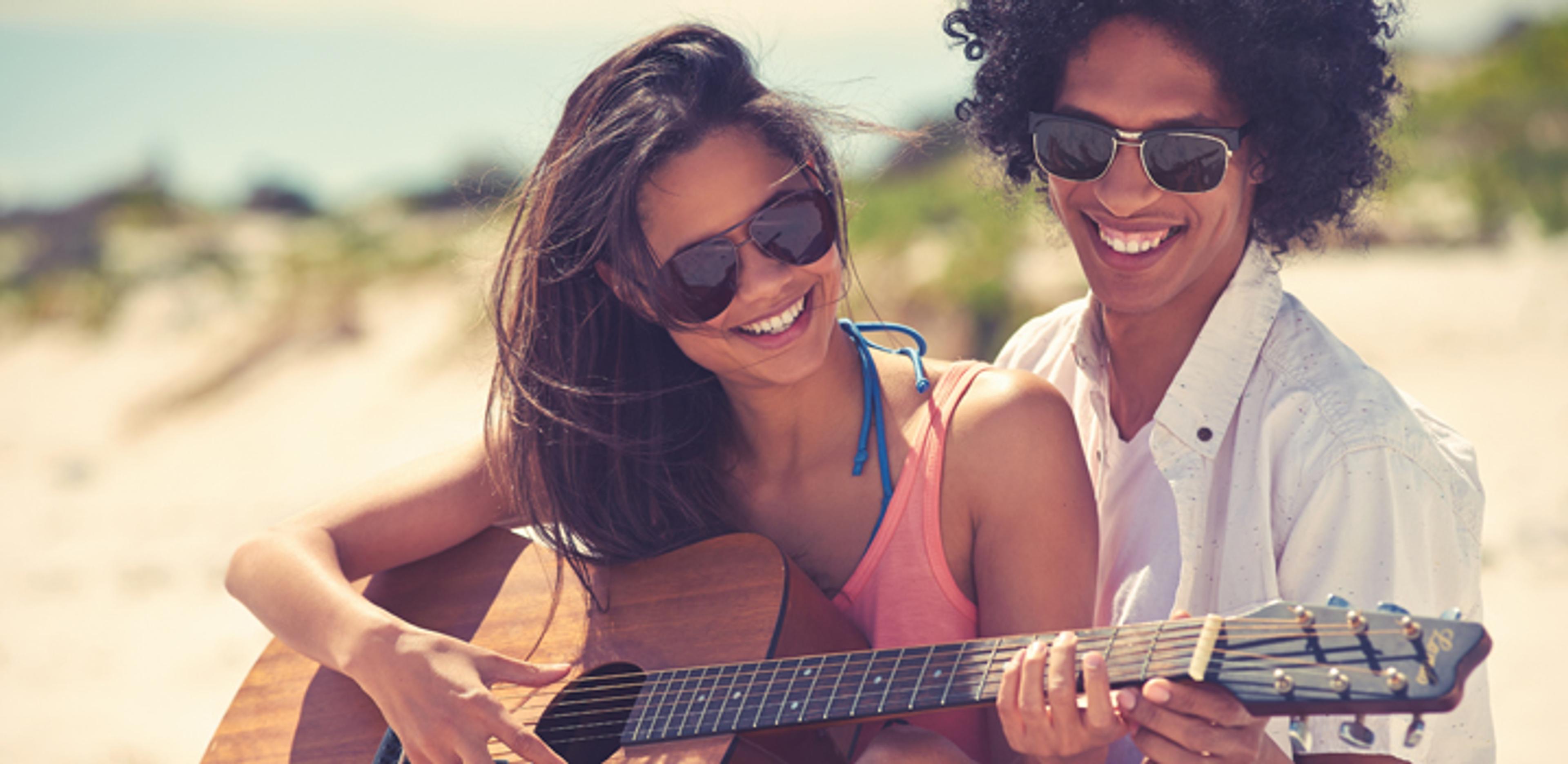 Couple playing guitar