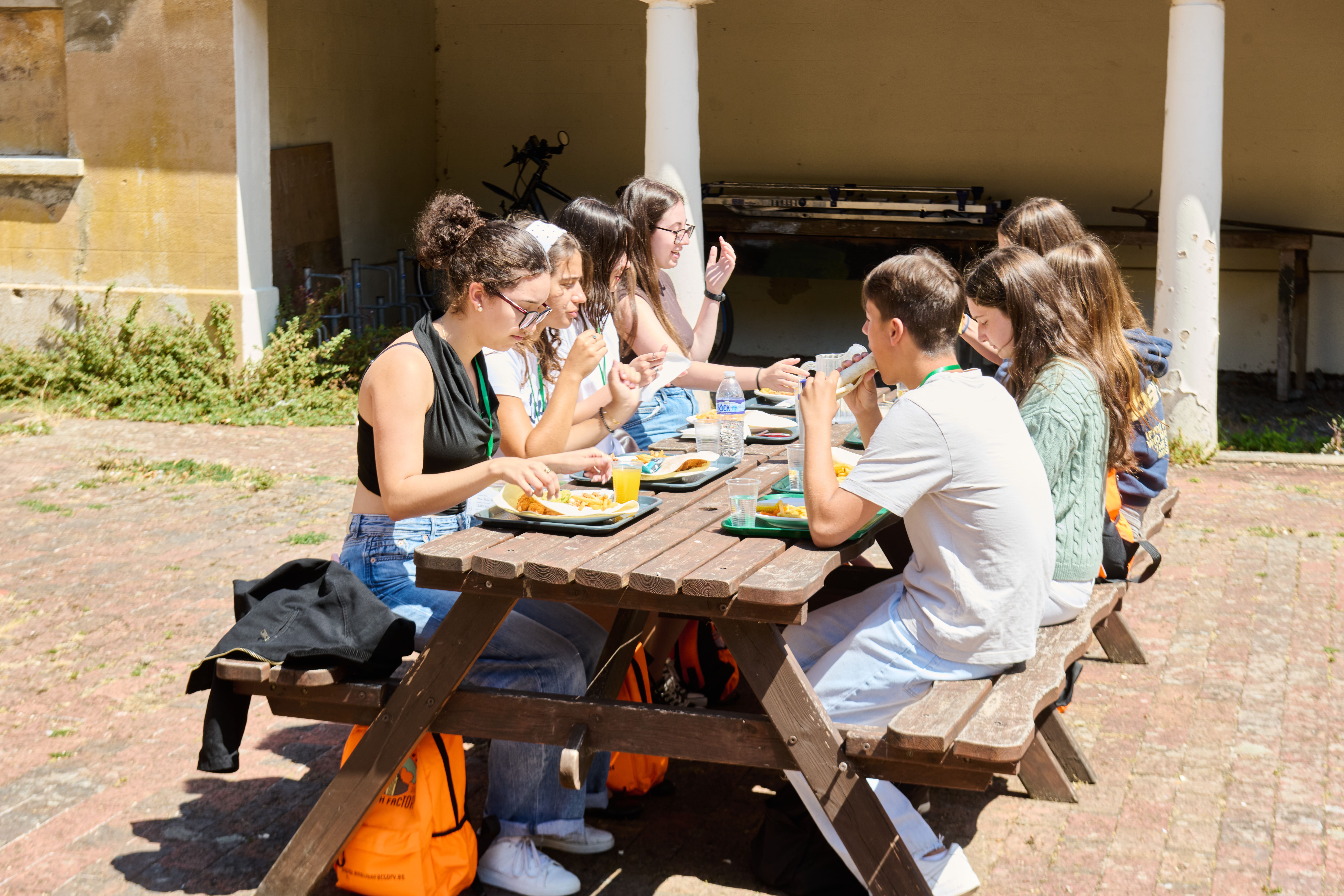 Students eating lunch outside in our Eastbourne English School