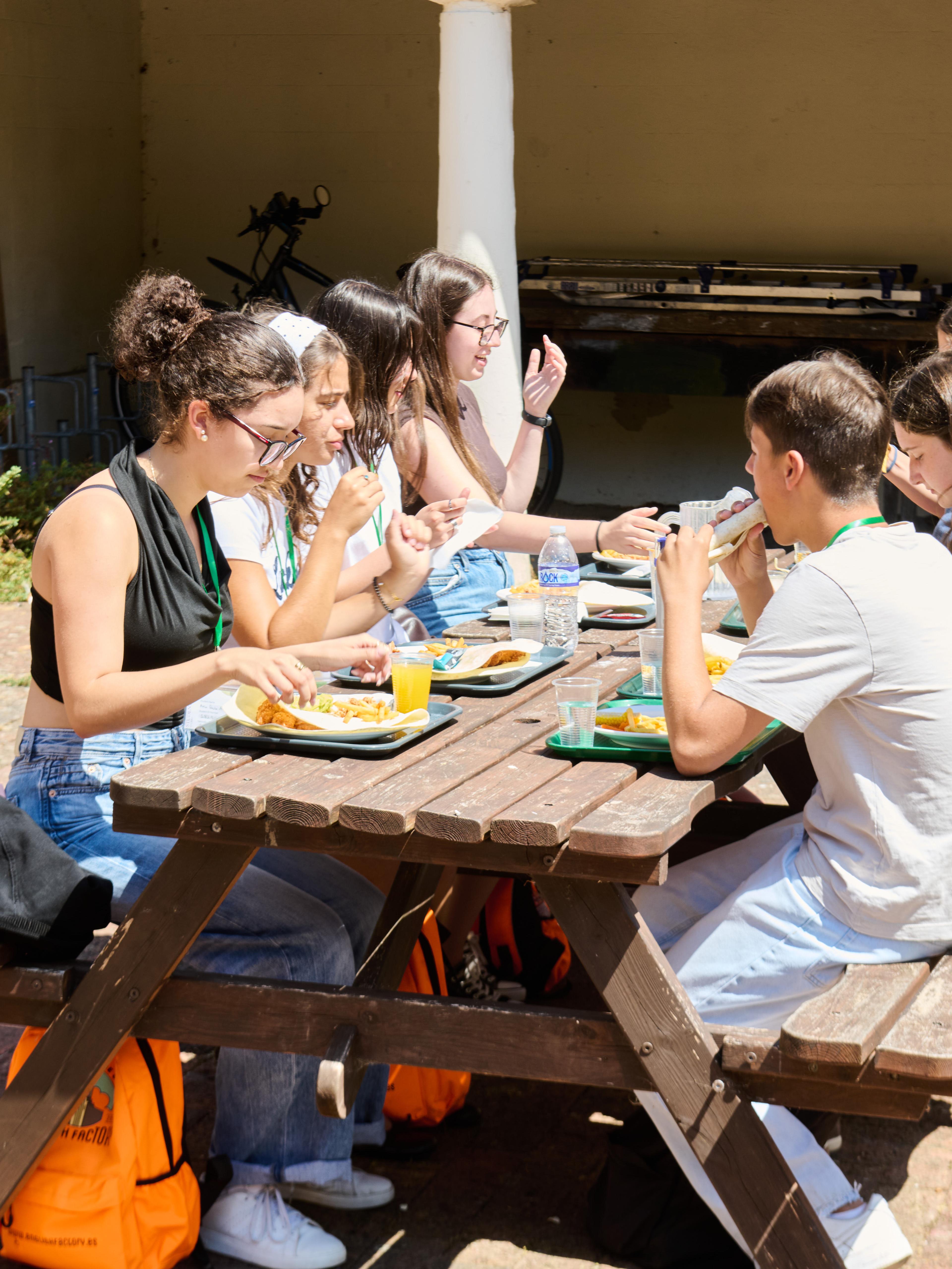 Students eating lunch outside in our Eastbourne English School