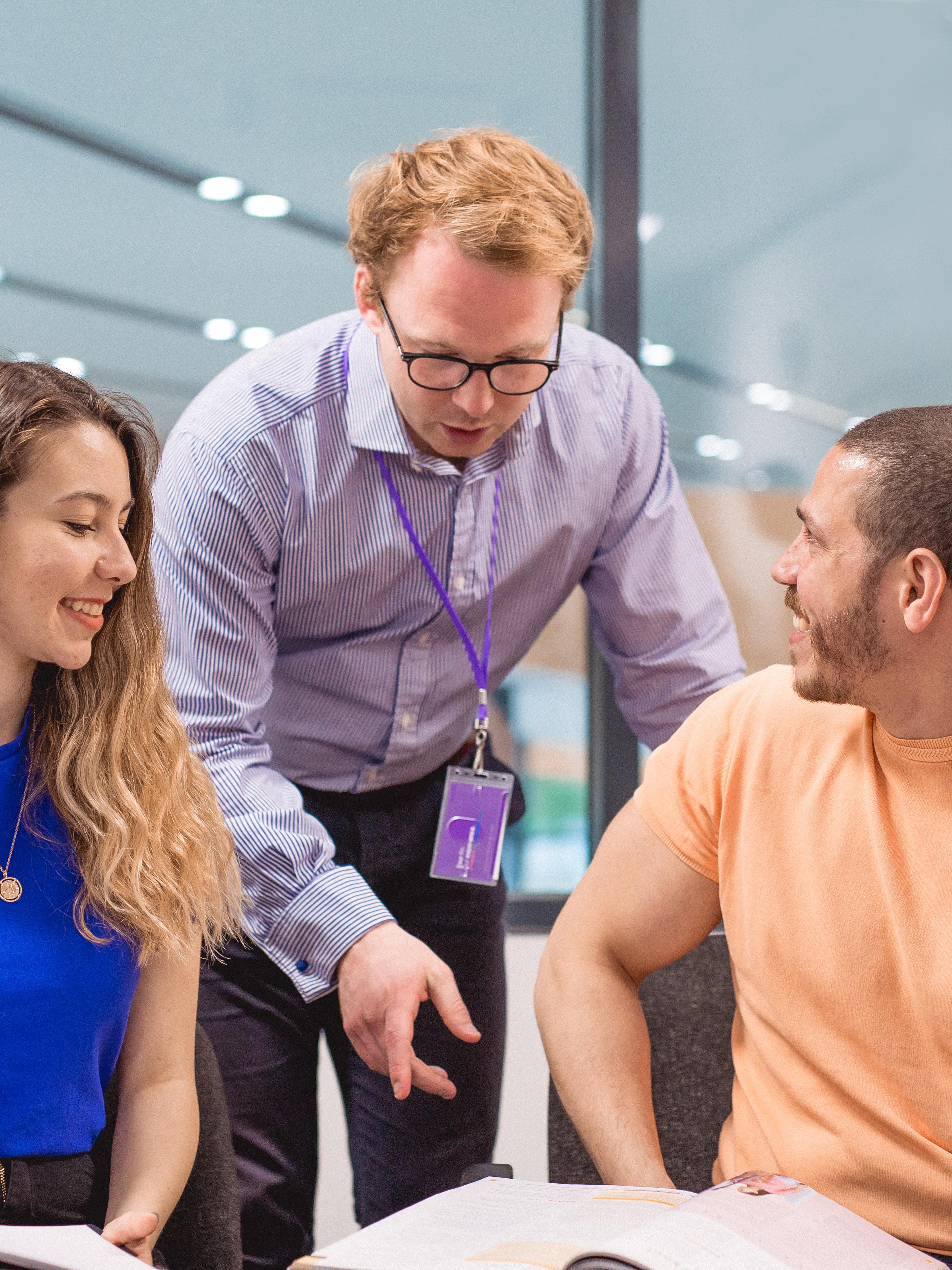 Students talking to teacher