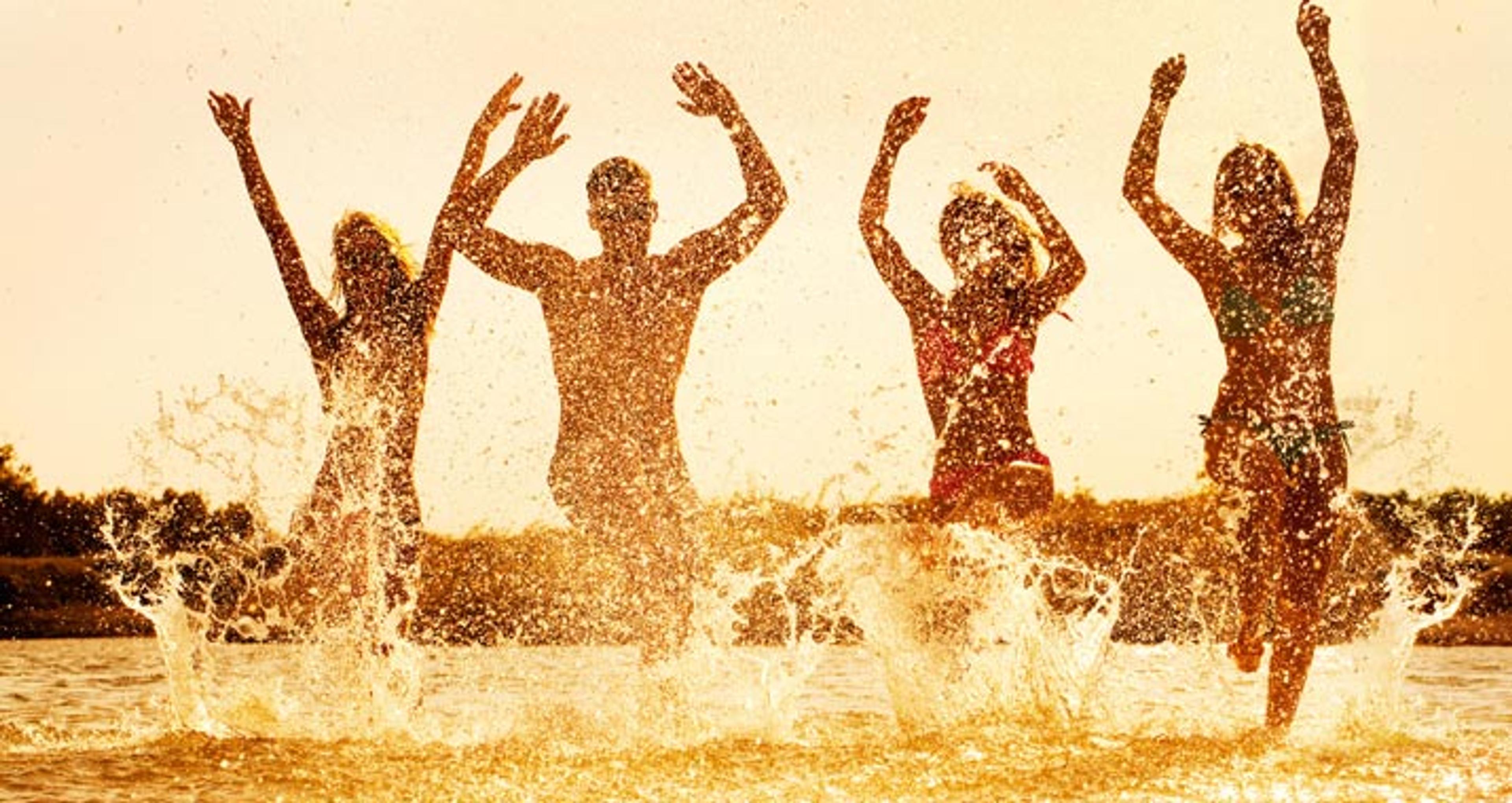 Students jumping in the sea