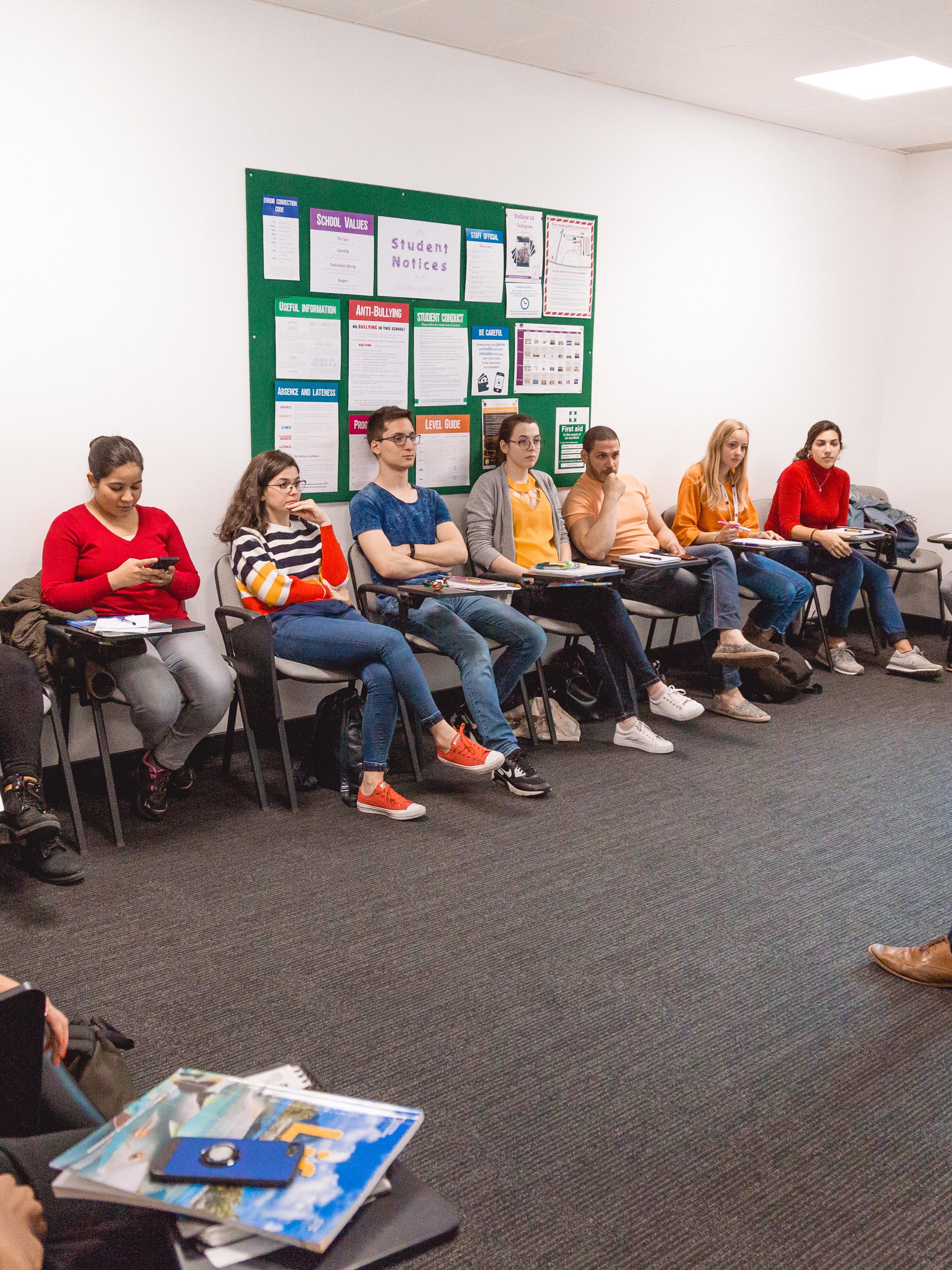 Twin students in classroom with teacher