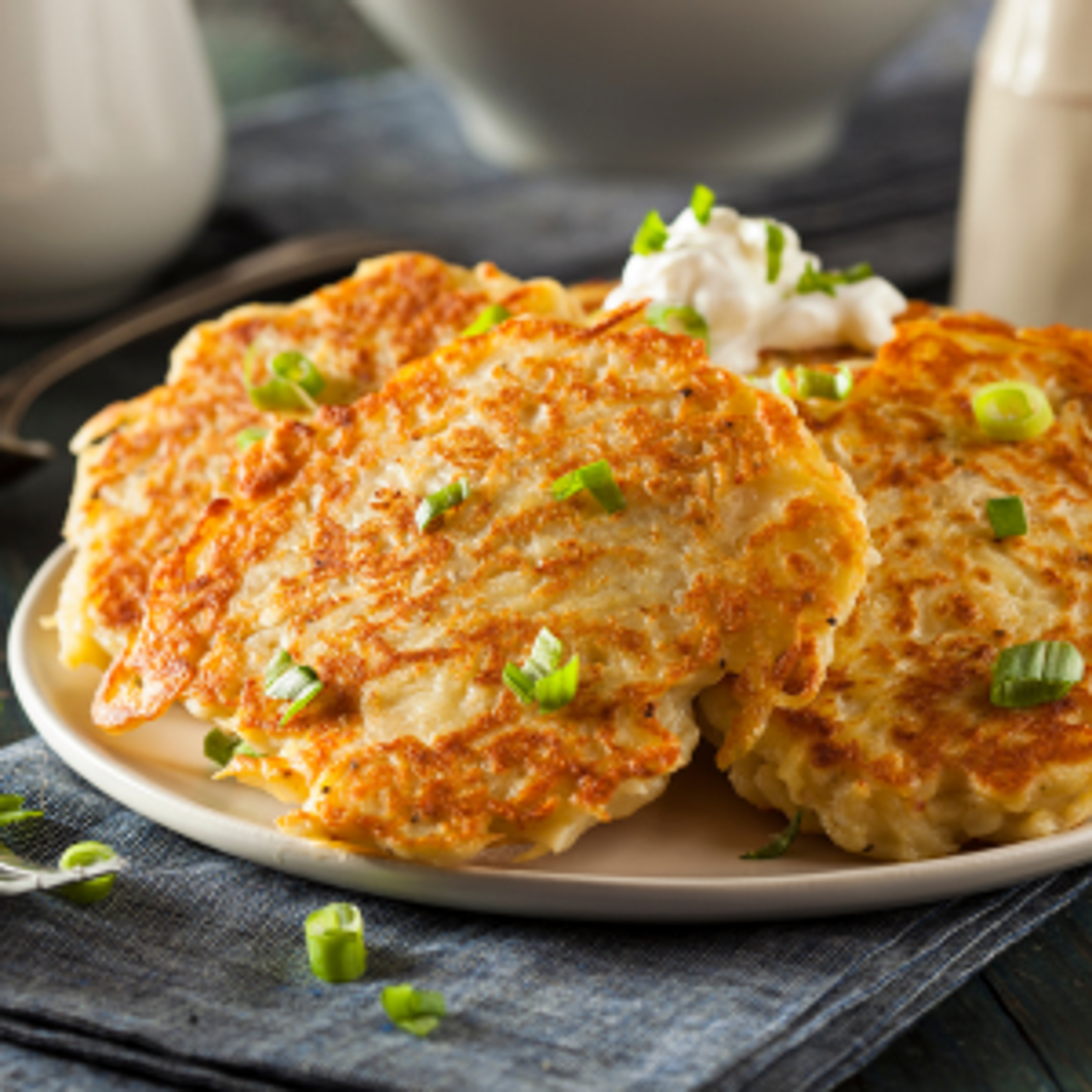 Boxty, made from potatoes, flour and buttermilk, and served with sour cream and spring onions