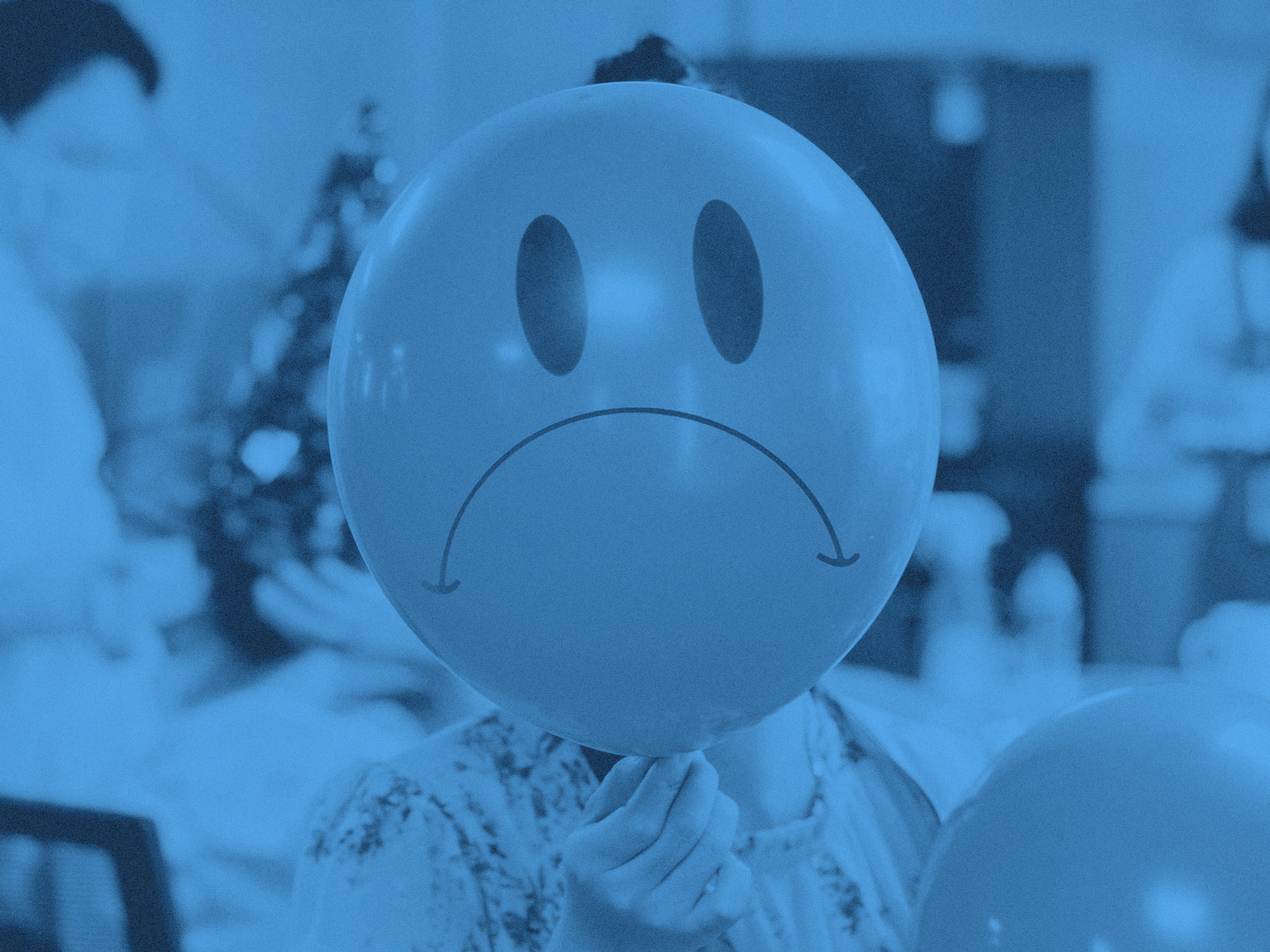 En ballong med en ledsen smiley-figur