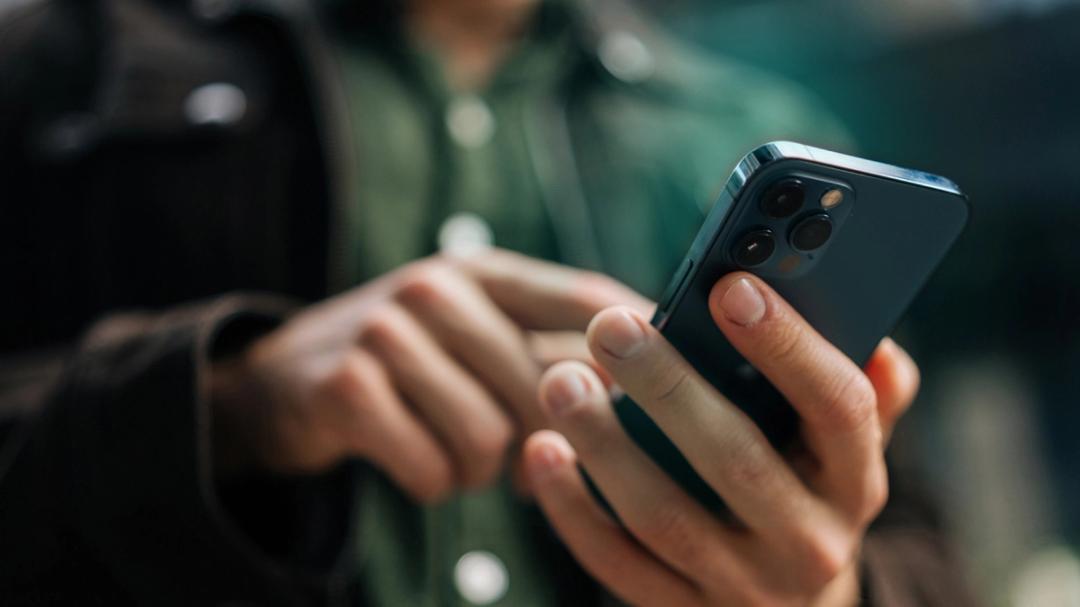 Person holding their phone