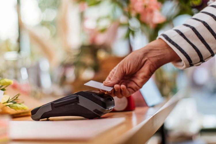 Credit card being tapped on card reader