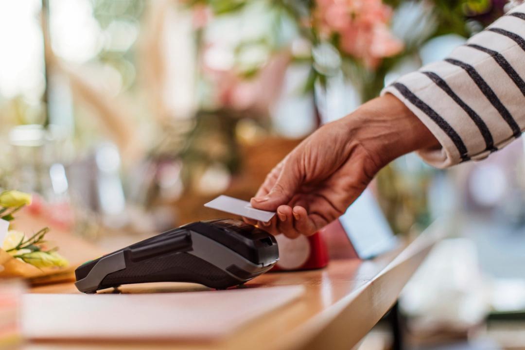 Credit card being tapped on card reader