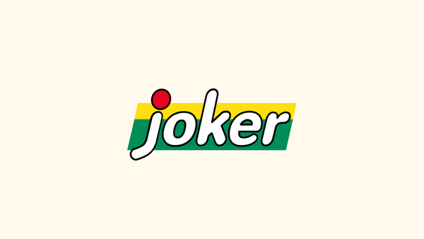 Joker-logoen på lysegul bakgrunn