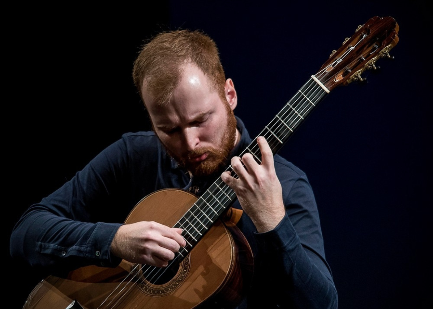 Marko Topchii playing the guitar.
