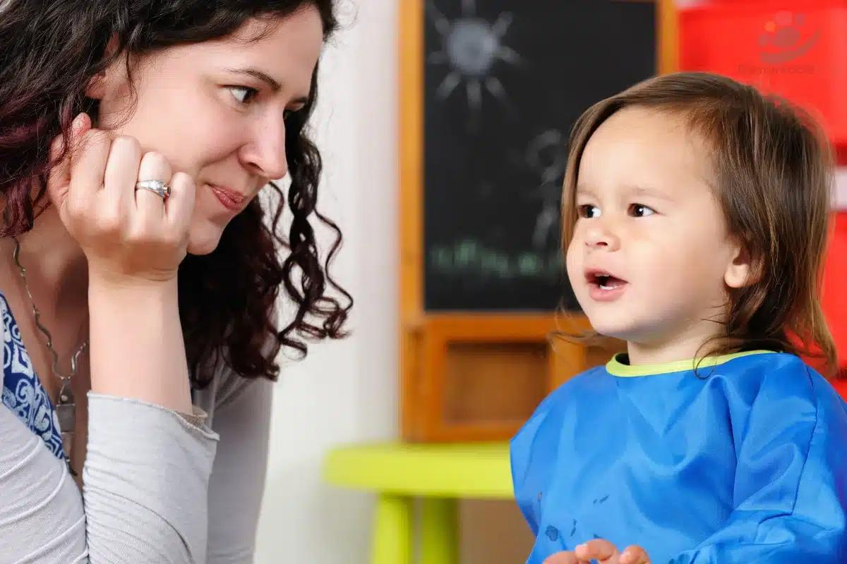 Caregiver and children engaging in gentle play with educational toys.