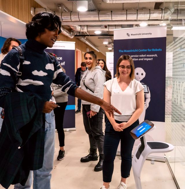 Workshop participant with a service robot