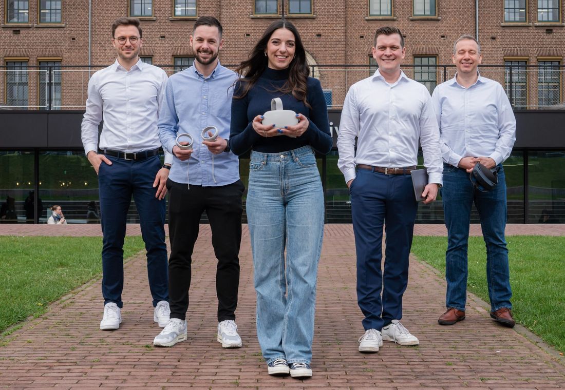 The DEXLab team holding VR headsets