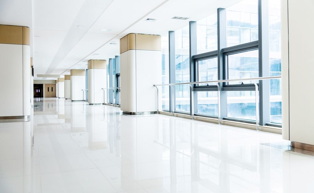 Bright, empty hospital corridor with large windows and handrails, illustrating winter hospital short-staffing and patient safety concerns in Pennsylvania.
