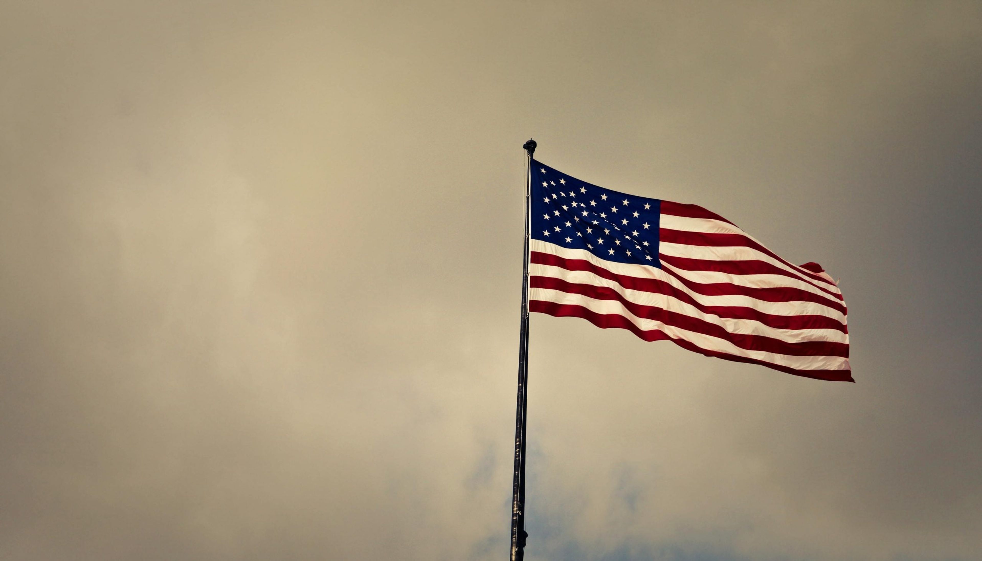 American flag flying outside a U.S. embassy visa appointment office