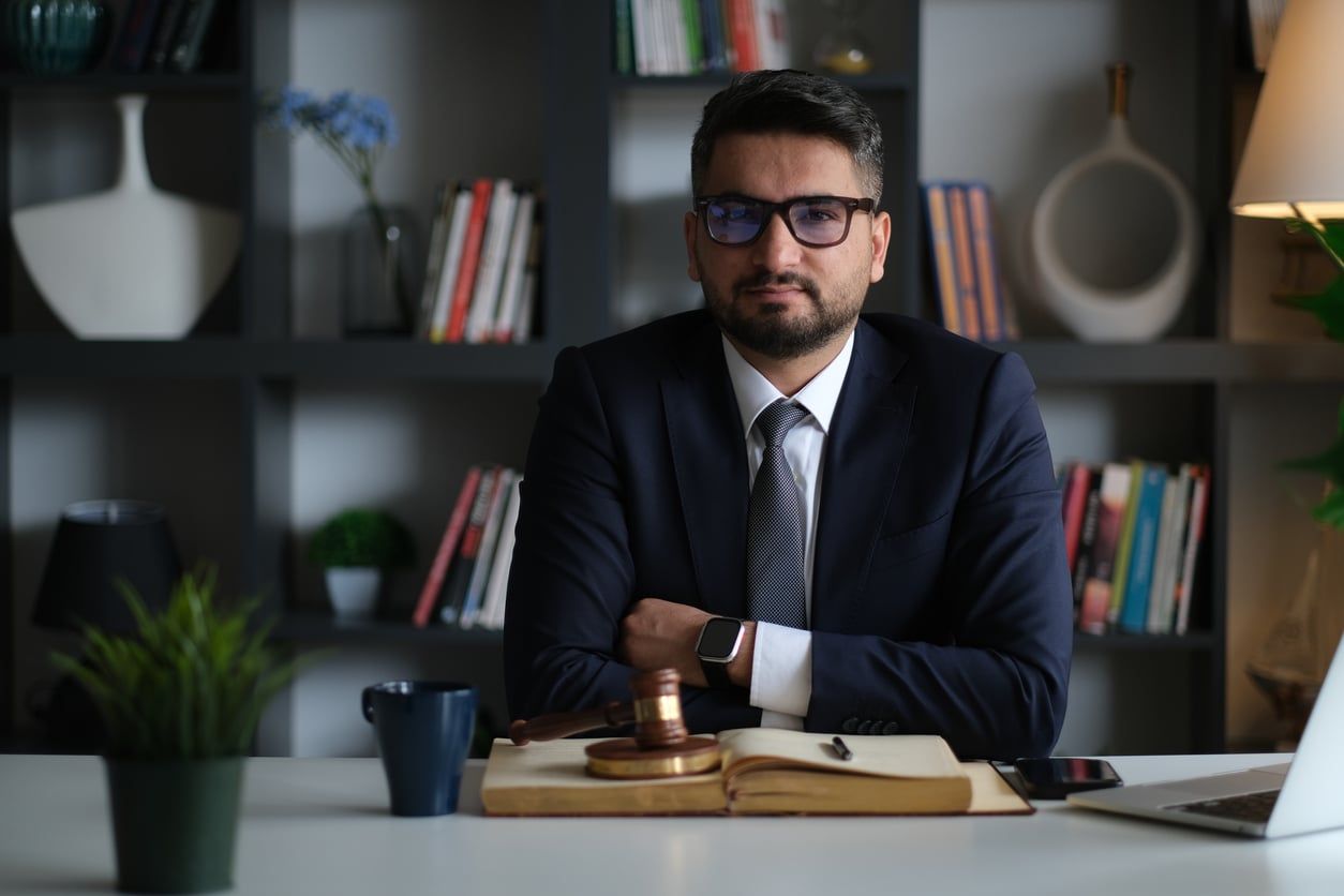 Lawyer sitting at office desk.