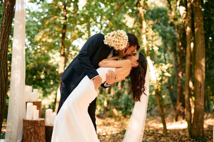 Bride and groom kissing at their wedding