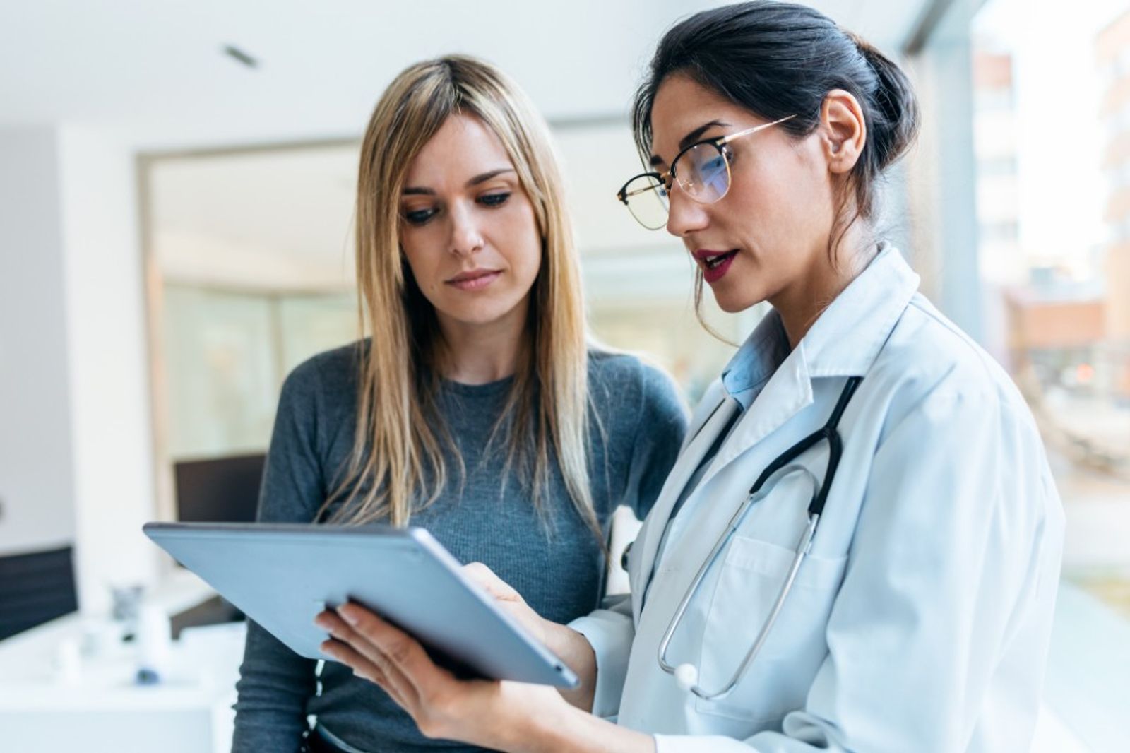 A physician meeting with an immigration attorney
