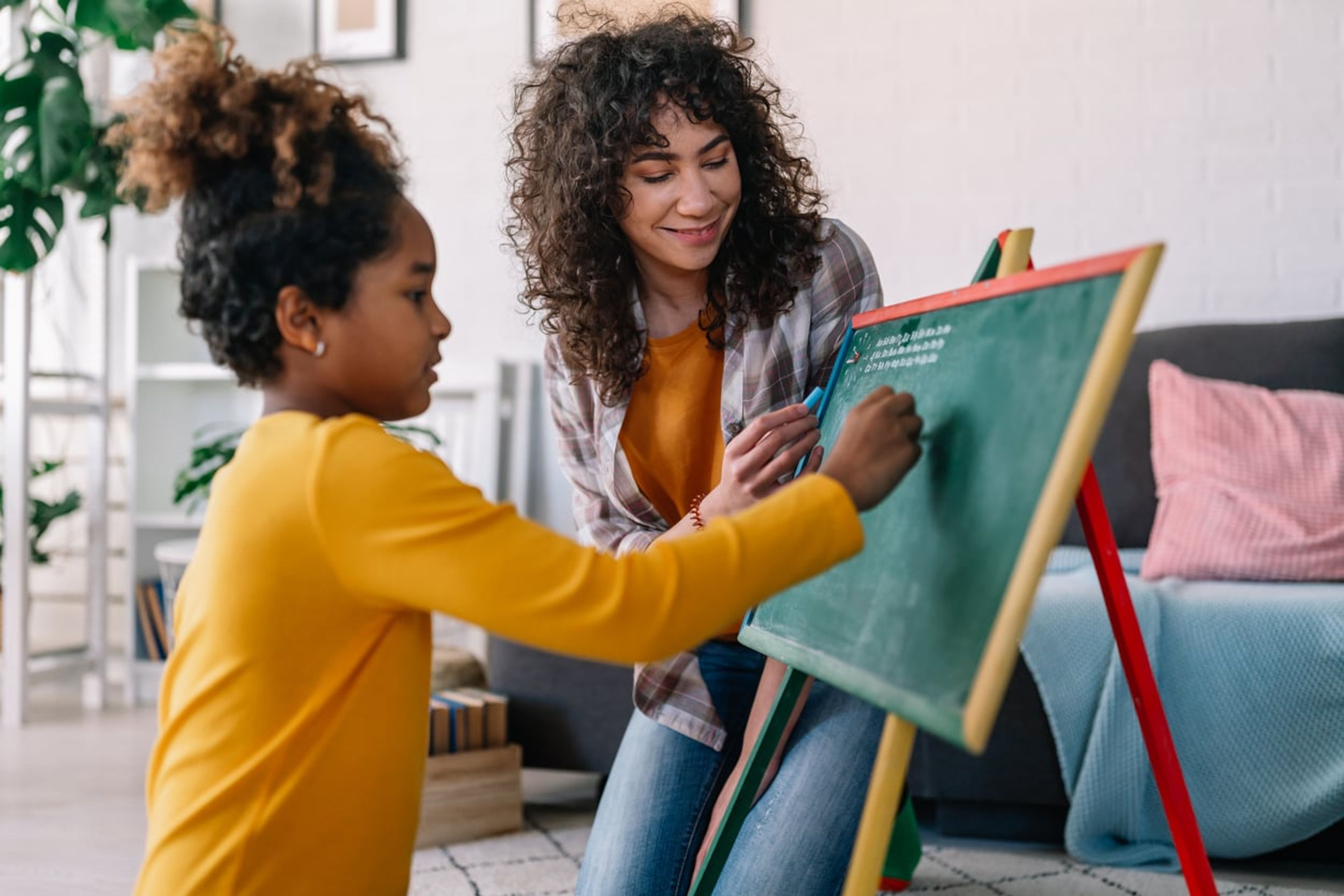 Au pair educating a child at their home