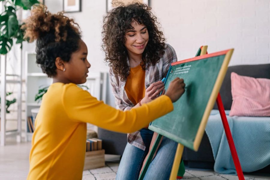 Au pair educating a child at their home