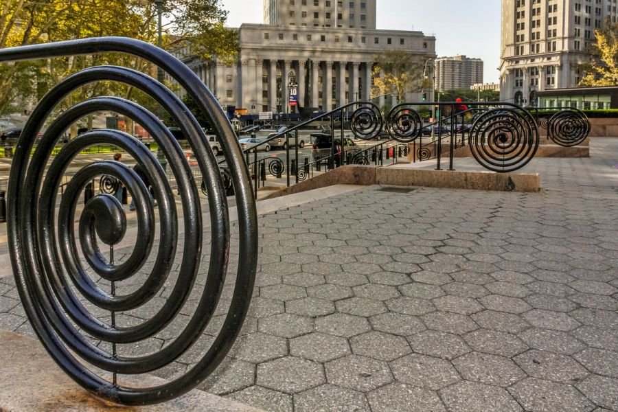black iron spiral railings at foley square outside manhattan's federal plaza, home to the new york immigration court where uscis can now refer asylum cases without an interview