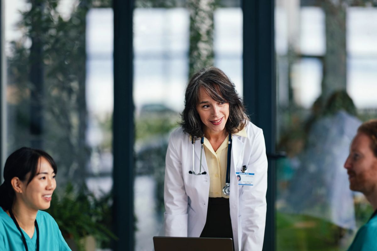 A physician reviewing Green Card options at a laptop