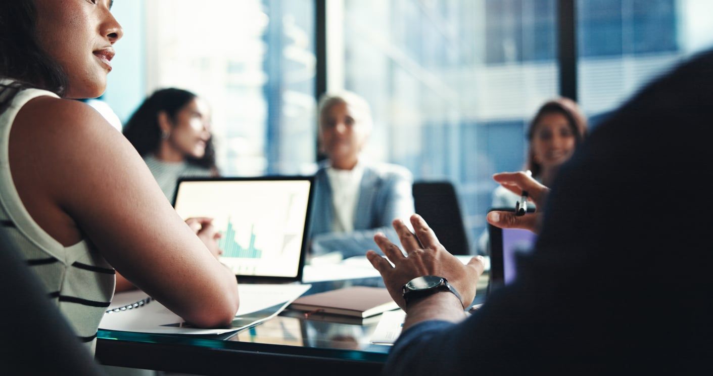 Investors at a meeting discussing their finances.
