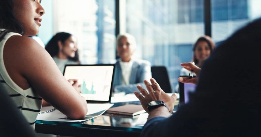 Investors at a meeting discussing their finances.