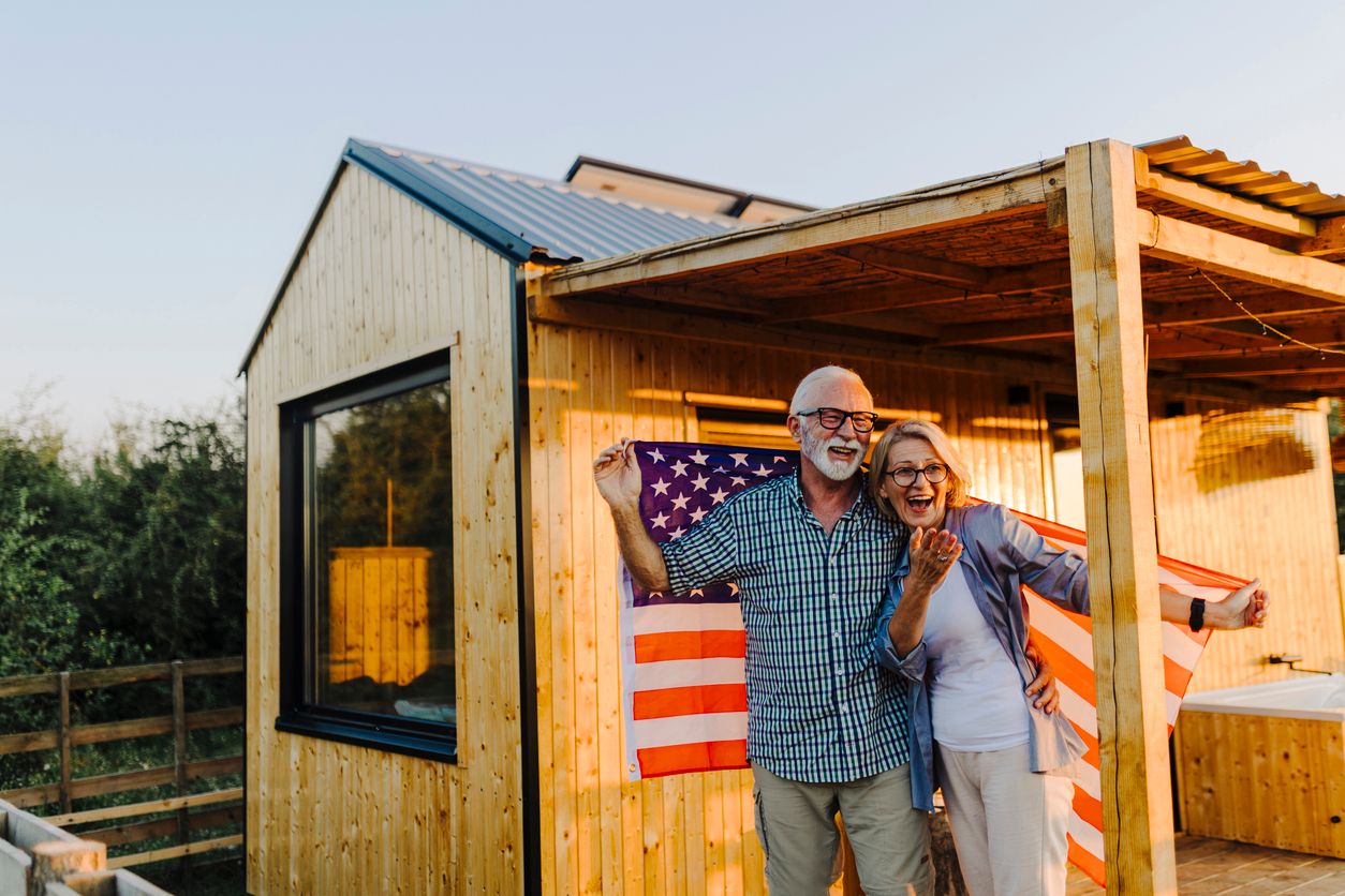 Family celebrating a child's Certificate of Citizenship with an American flag