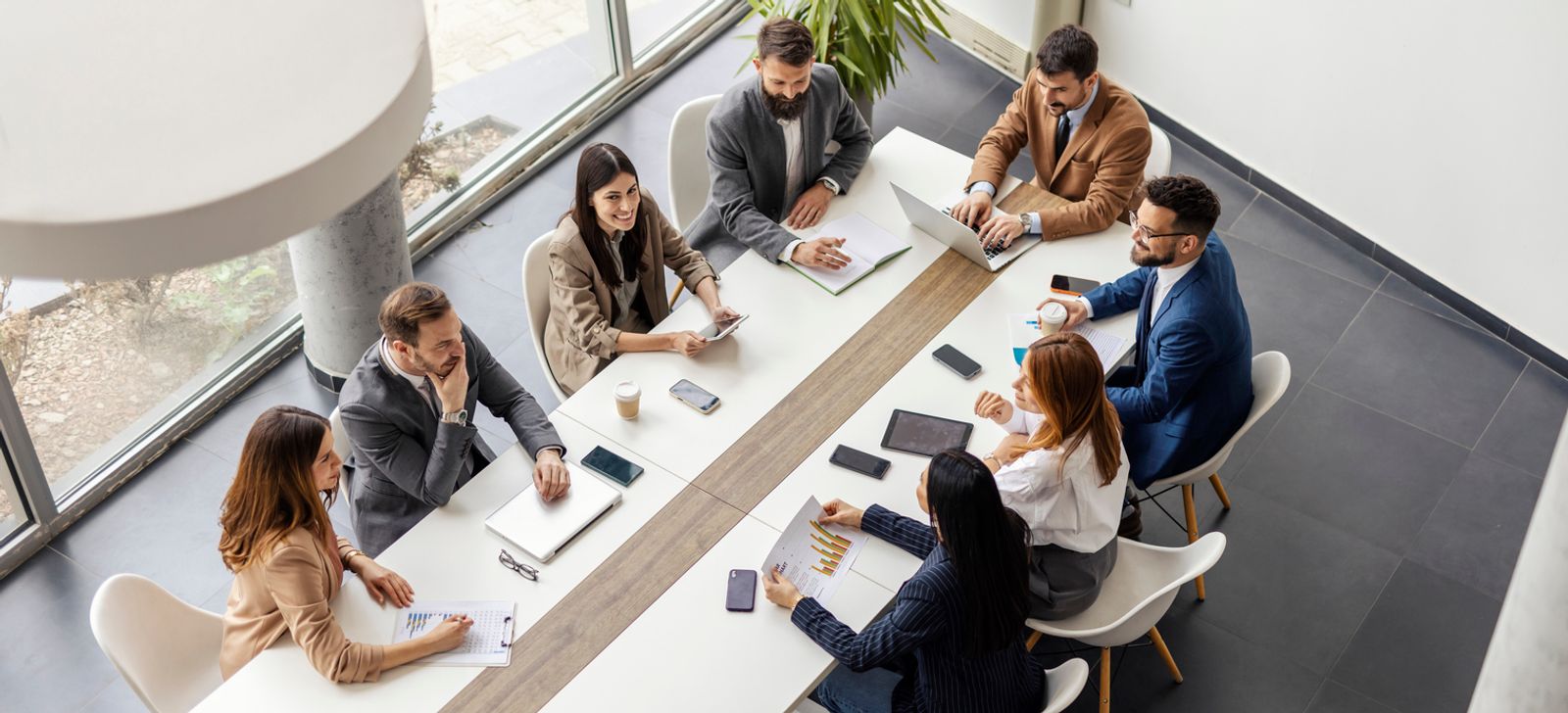 Legal team reviewing case strategy together around a conference table