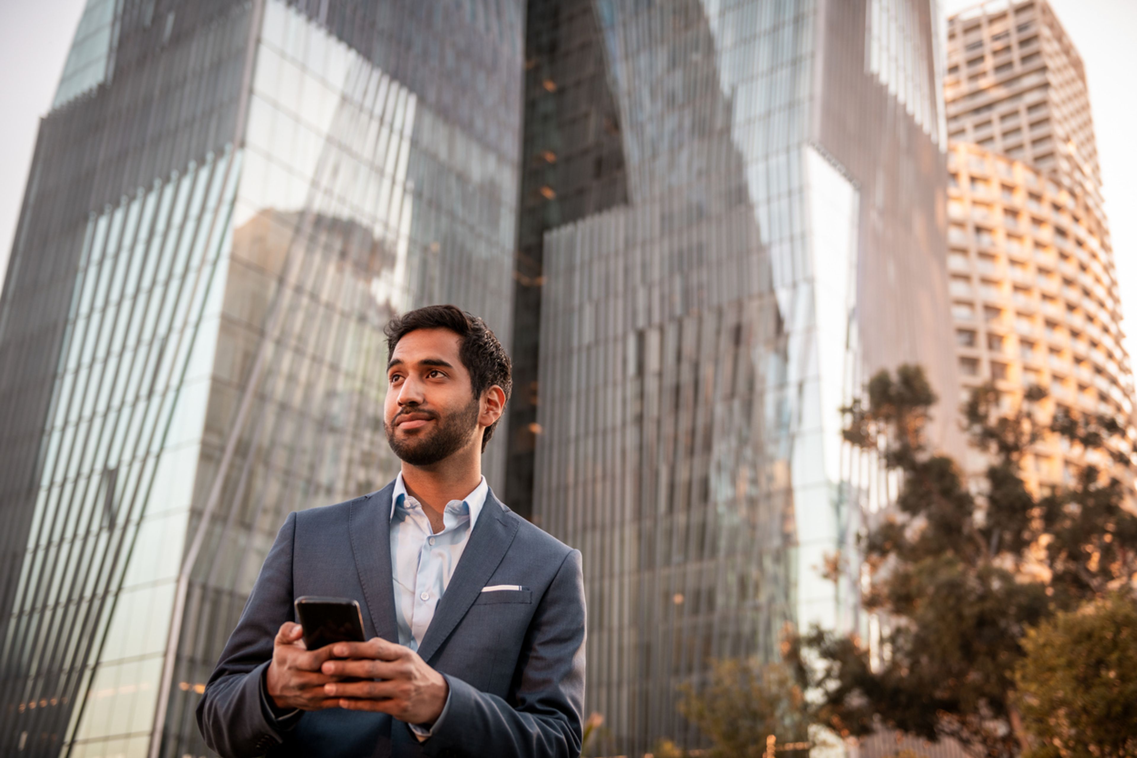 Portrait of a young businessman using a mobile phone