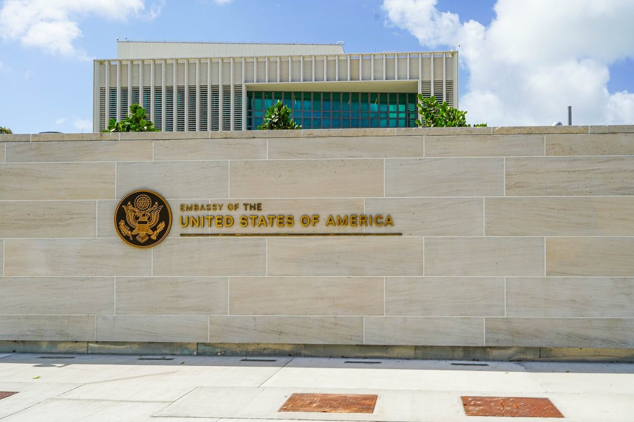 U.S. embassy building exterior where consular visa services are paused
