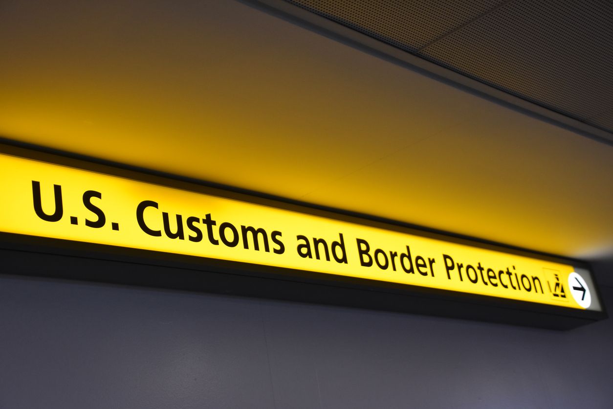 A sign for U.S. Customs and Border Protection (CBP) at an airport