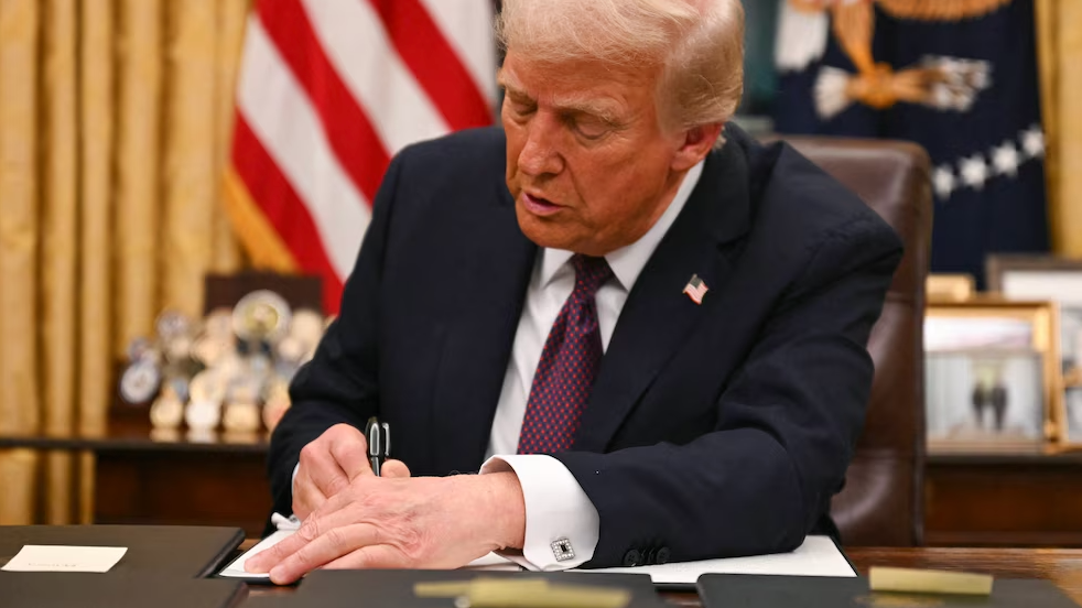 Startup founder at a laptop exploring H-1B self-sponsorship options
