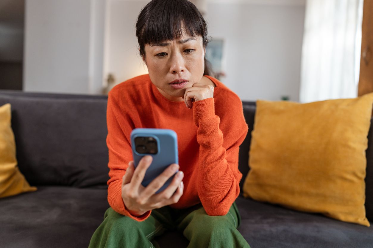 Worried person on the phone receiving a suspected immigration scam call