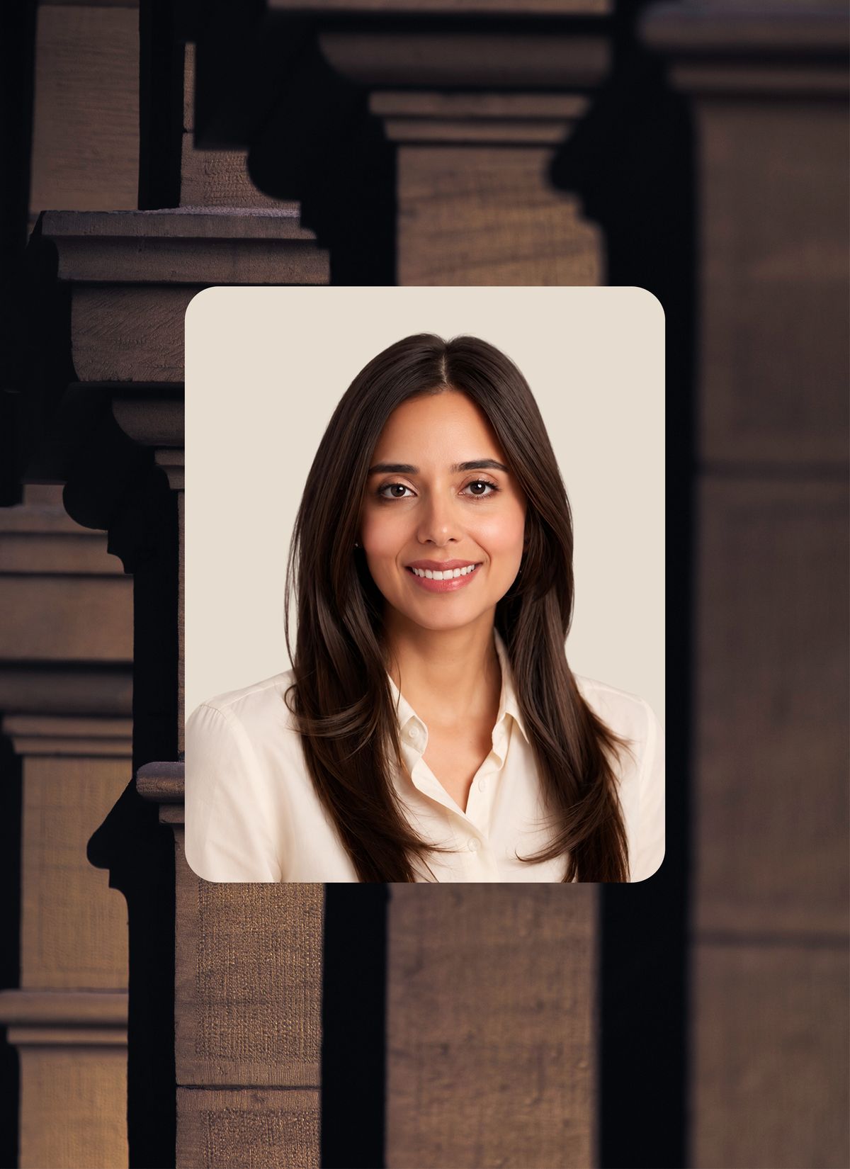 Nadia Zaidi framed over architectural columns